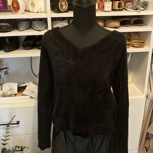 Women’s size large black fuzzy sweater.